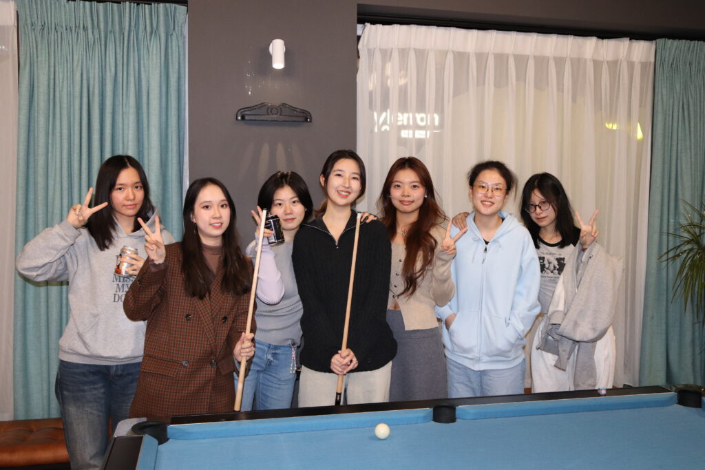 Students playing pool