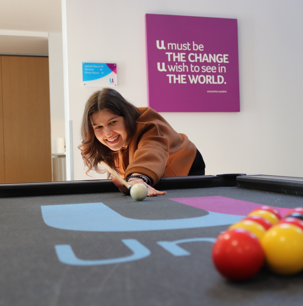 Student playing pool