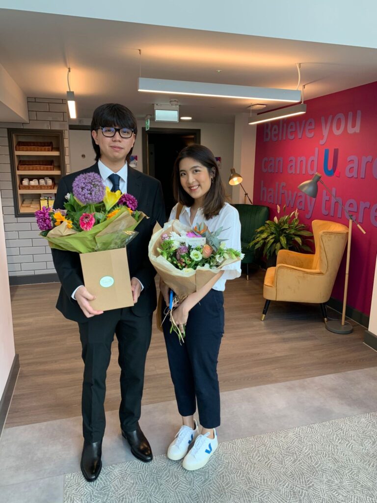 A student couple graduating